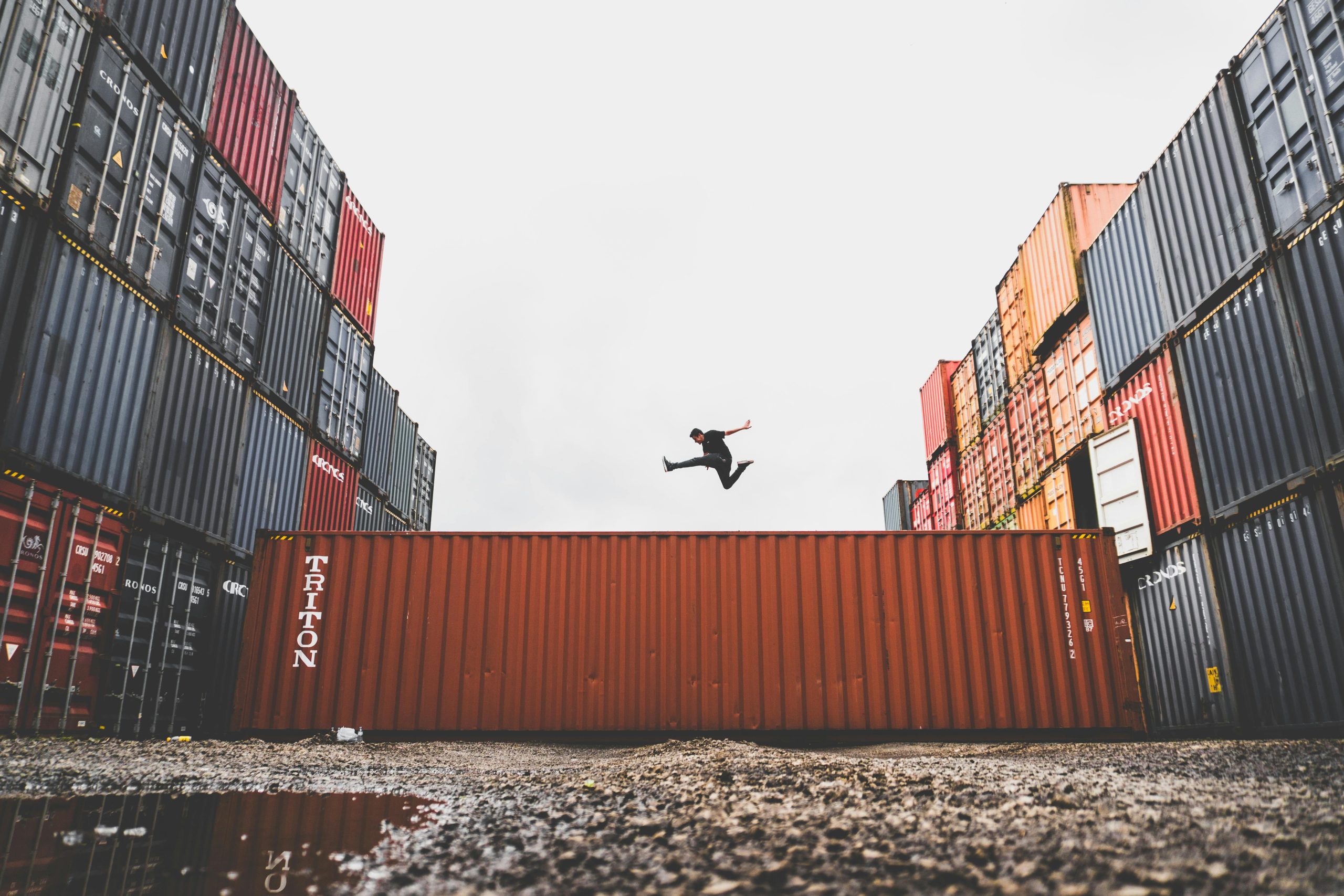 Shipping containers in a port representing trade secured by bank guarantees from Artley Finance (HK) Limited.