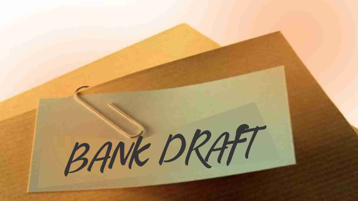 Bank draft document clipped with a paperclip on a brown envelope, symbolizing financial security and safe transactions