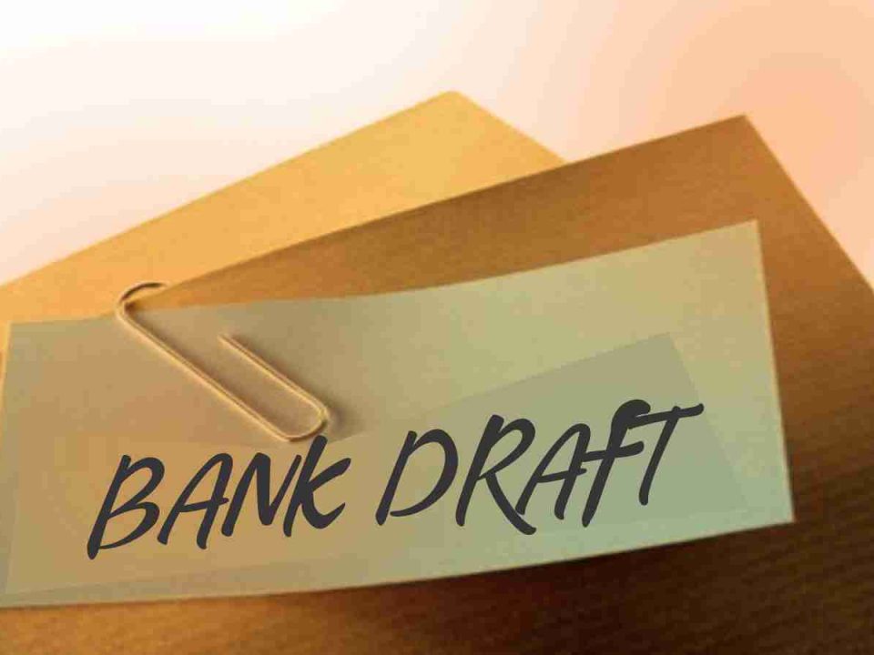 Bank draft document clipped with a paperclip on a brown envelope, symbolizing financial security and safe transactions